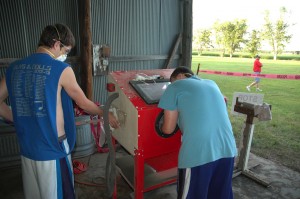 Joe Fitters and David George at the sand blasting station.