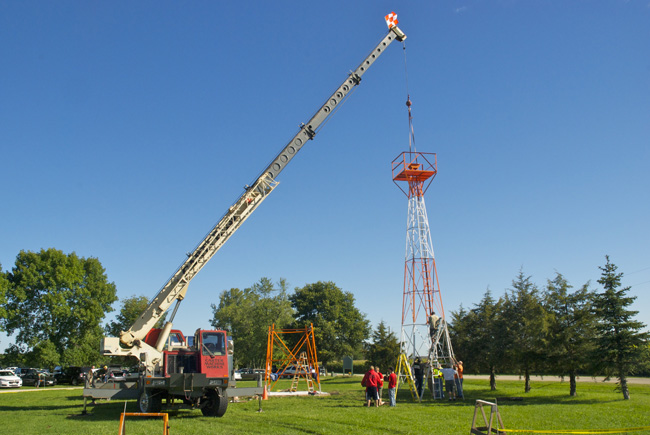 Crane Lifts the Beacon Tower