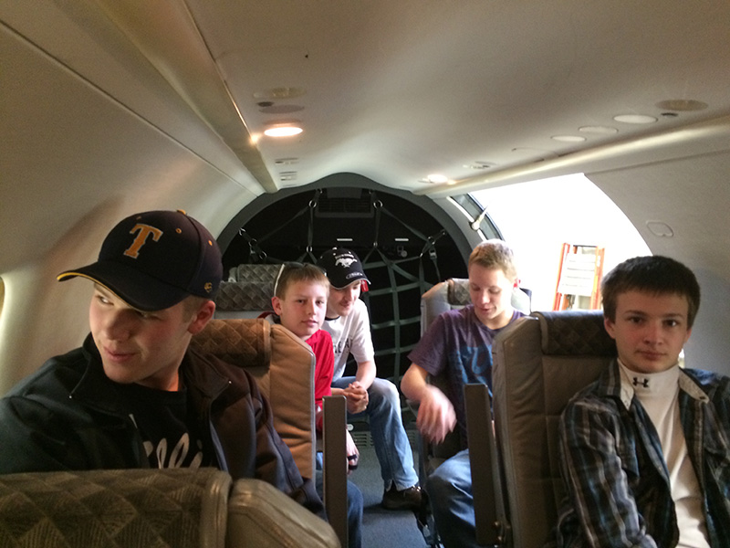 Explorer Scouts sit in the passenger section of Wisconsin Air Service's Pilatus PC-12.
